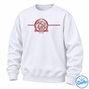 Distressed red circular celestial emblem with stars, intersecting lines, crossed details, and small lettering on a dark background