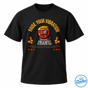 Raise Your Vibration shirt design with a cartoon character, golden lettering, orange flames, stars, and an uplifting quote.
