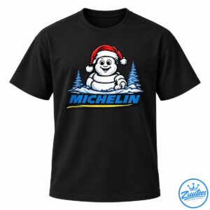Cartoon snowman wearing a red Santa hat above blue MICHELIN lettering, with snowy pine trees and a yellow underline.