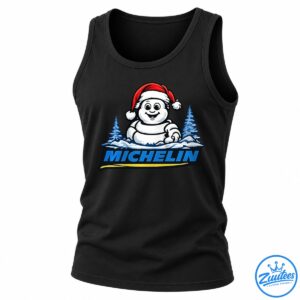Cartoon snowman wearing a red Santa hat above blue MICHELIN lettering, with snowy pine trees and a yellow underline.