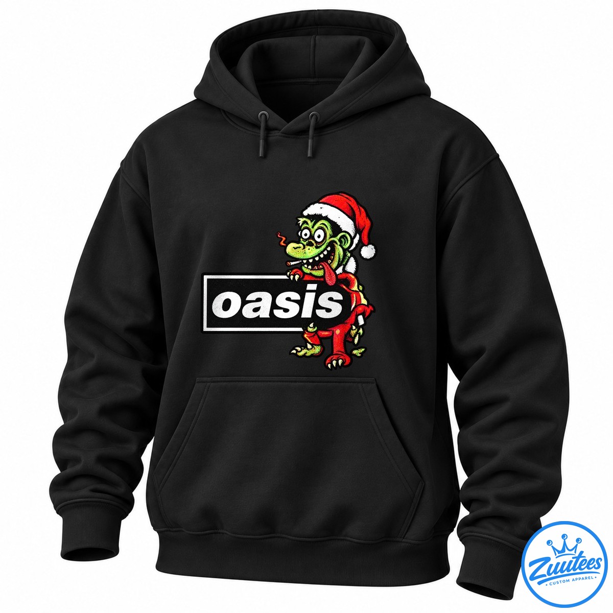 Rat Fink X Oasis Live ’27 Some Christmas Will Never Fade Away Shirt Green cartoon character in a red Santa hat leaning over a black panel with bold white oasis lettering.