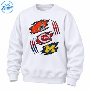 Distressed sports graphic with an orange football helmet, REDS emblem, golden M, and red claw marks on torn fabric shapes