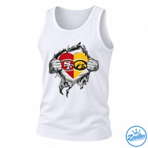 Split red and gold heart with SF and hawk emblems revealed by torn metallic silver material and muscular hands.