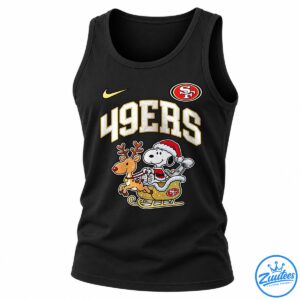 49ers Snoopy shirt design with Snoopy in a Santa suit riding a gold sleigh pulled by a reindeer.