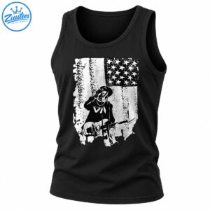 Black and white distressed graphic featuring a wide-brimmed-hat guitarist, microphone, electric guitar, and weathered American flag.