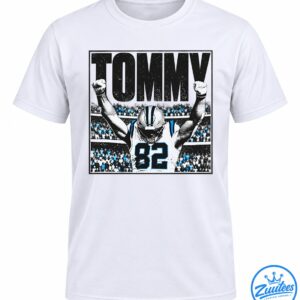 Tommy Balboa football graphic with large black lettering, a player wearing jersey 82, raised fists, and a blue-accented stadium crowd