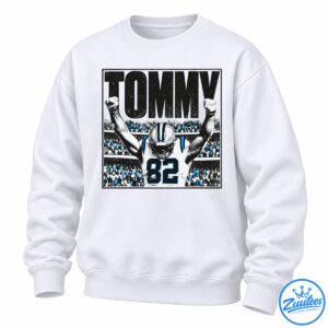 Tommy Balboa football graphic with large black lettering, a player wearing jersey 82, raised fists, and a blue-accented stadium crowd