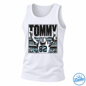 Tommy Balboa football graphic with large black lettering, a player wearing jersey 82, raised fists, and a blue-accented stadium crowd