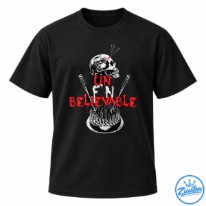 Black shirt design with a distressed white skull, spiked and barbed weapons, and dripping red UN BELIEVABLE lettering.