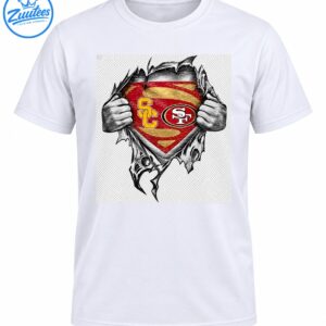 Grayscale hands ripping open fabric to reveal a distressed red and gold shield with SC and SF football emblems